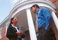 Photo of a professor and graduate student outside of Long Building.