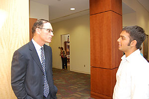 Marc Trestman, left, with student
