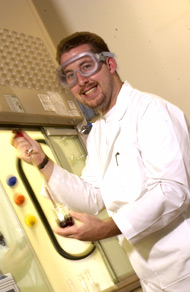 Photo of an Elon University student in a science lab.