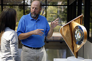 Professor talking with student about sculpture