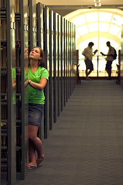 Student looking for material at Belk Library