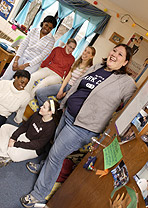 Photo of Elon University students in a dorm room.