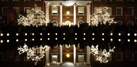 Luminaries circle Fonville Fountain before a stately Alamance.