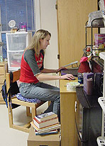 Photo of Elon University student in her dorm room.