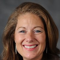 Headshot of Virginia Novine-Whittaker.