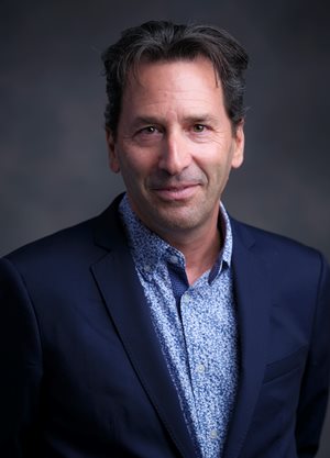 Headshot of Adam Jordan