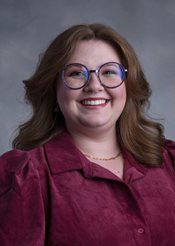 Headshot of Alaina Mills