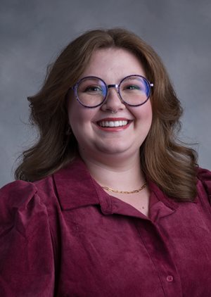 Headshot of Alaina Mills