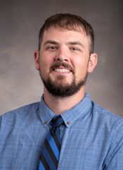 Headshot of Cam Adams