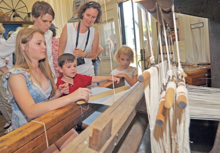 A family visiting the Textile Heritage Museum at Glencoe.