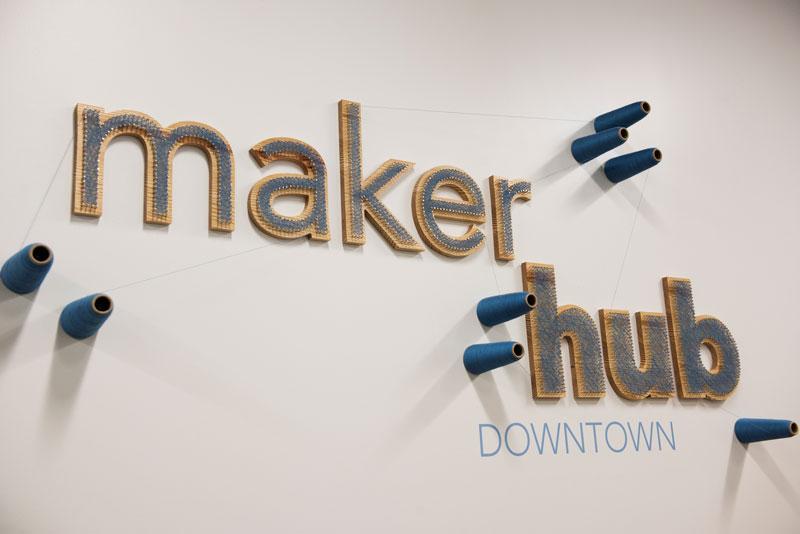 Sign on Maker Hub Downtown wall.