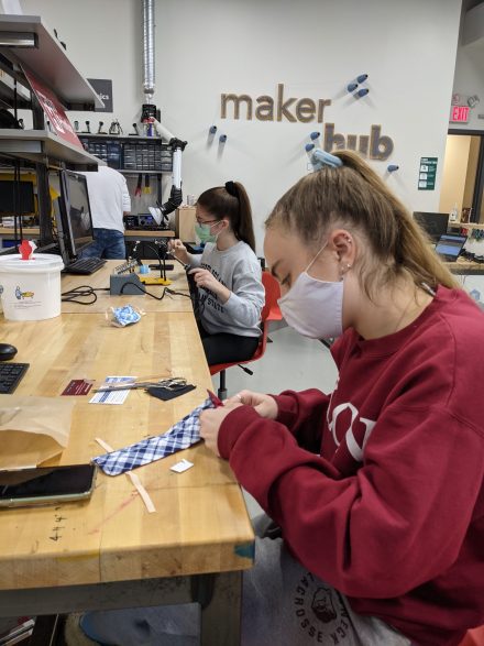 Students complete facemask projects at the Maker Hub