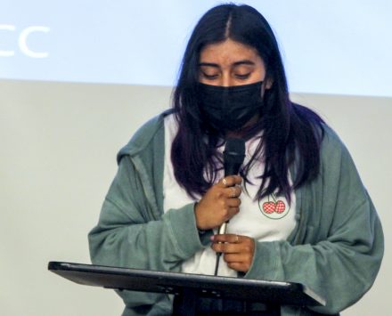 Early College junior Yesenia Santiago reads her piece "The World I Wish to See" Friday at Alamance Community College. 