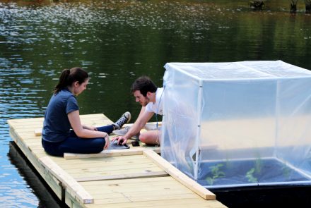 Georgia Gurney '21 and Trent Houpt '21 test their team's gas sensor design May 15. Inside a prototype plastic enclosure, their design measures oxygen, methane and carbon dioxide released by plants on floating constructed wetlands modules.