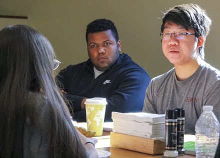 Nicholas Rugbart '25, center, has improved his Chinese fluency by attending Polyglot Lunches this fall.