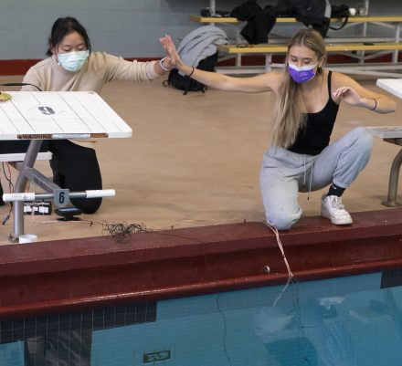 Apple Ngamwong, left, and Litza Mauck celebrate after completing a task with their underwater vehicle.