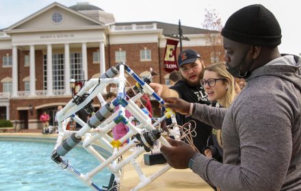 Parris Lowery '25 retrieves his team's remotely operated vehicle from Chandler Fountain during a test expedition the last week of classes.