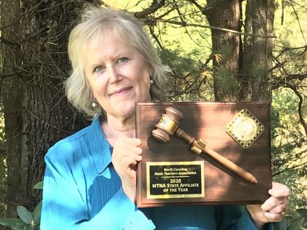 Professor Emerita of Music Vicky Fischer Faw with the Music Teachers National Association award recognizing North Carolina's associate as its affiliate of the year in 2020. Fischer then served as president of the N.C. Music Teachers Association.